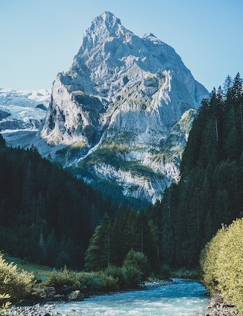 Majestic Swiss mountain peaks rising above clouds with dramatic Alpine landscape